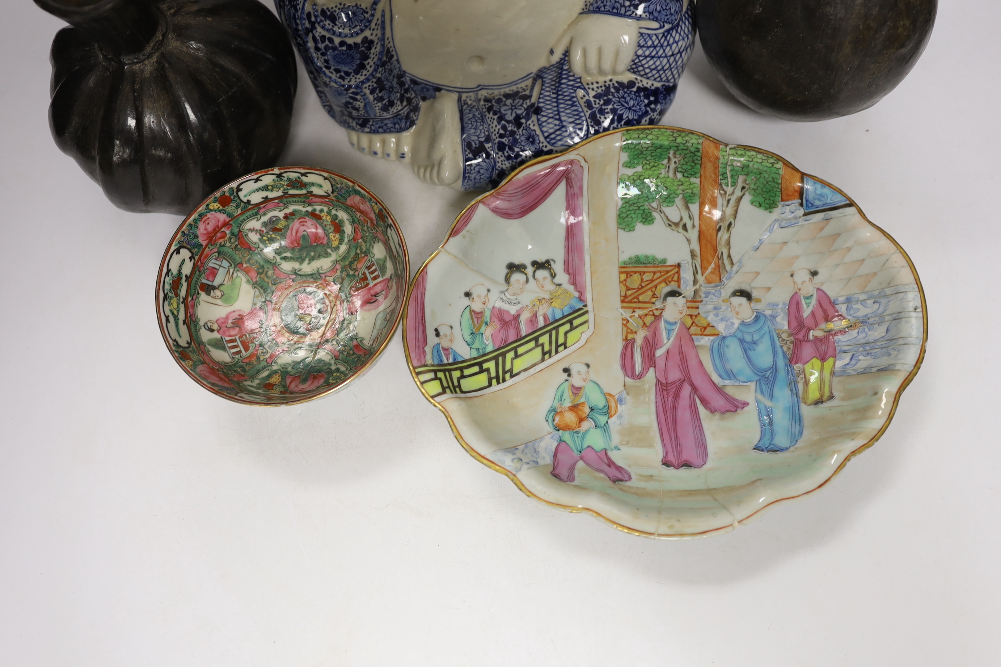 A Chinese blue and white buddha, 21cm, a famille rose dish and bowl and two vessels
